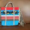 Light blue & multi colors, tan handle and fringe, 14 x 14"