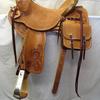 #3312 Chuck Shepard tree; 15 1/2" seat; 2 3/4" x 2 3/4" wood post horn; 4" cantle; flat plate rigging; rough-out seat with border stamp; fenders, jockeys, & fork cover rose carved; saddle bags. 