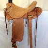 saddle #6119; 58 Wade tree, rough-out seat and stirrup fenders.  Wood post horn, Cheyenne roll, 7/8 flat plate rigging.