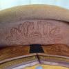 Horse carving on back of seat