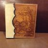 photo album, bucking horse with floral carving