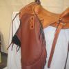 Brown with black double fringe, floral carving, basket stamp, and initials on overlays.