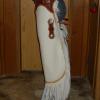 White chinks with long, skinny fringe, conchos, flower carved overlays, contrasting trim.