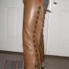 Shotgun chaps made with chap tanned buffalo hide.  Stamped overlays with initials on leg.